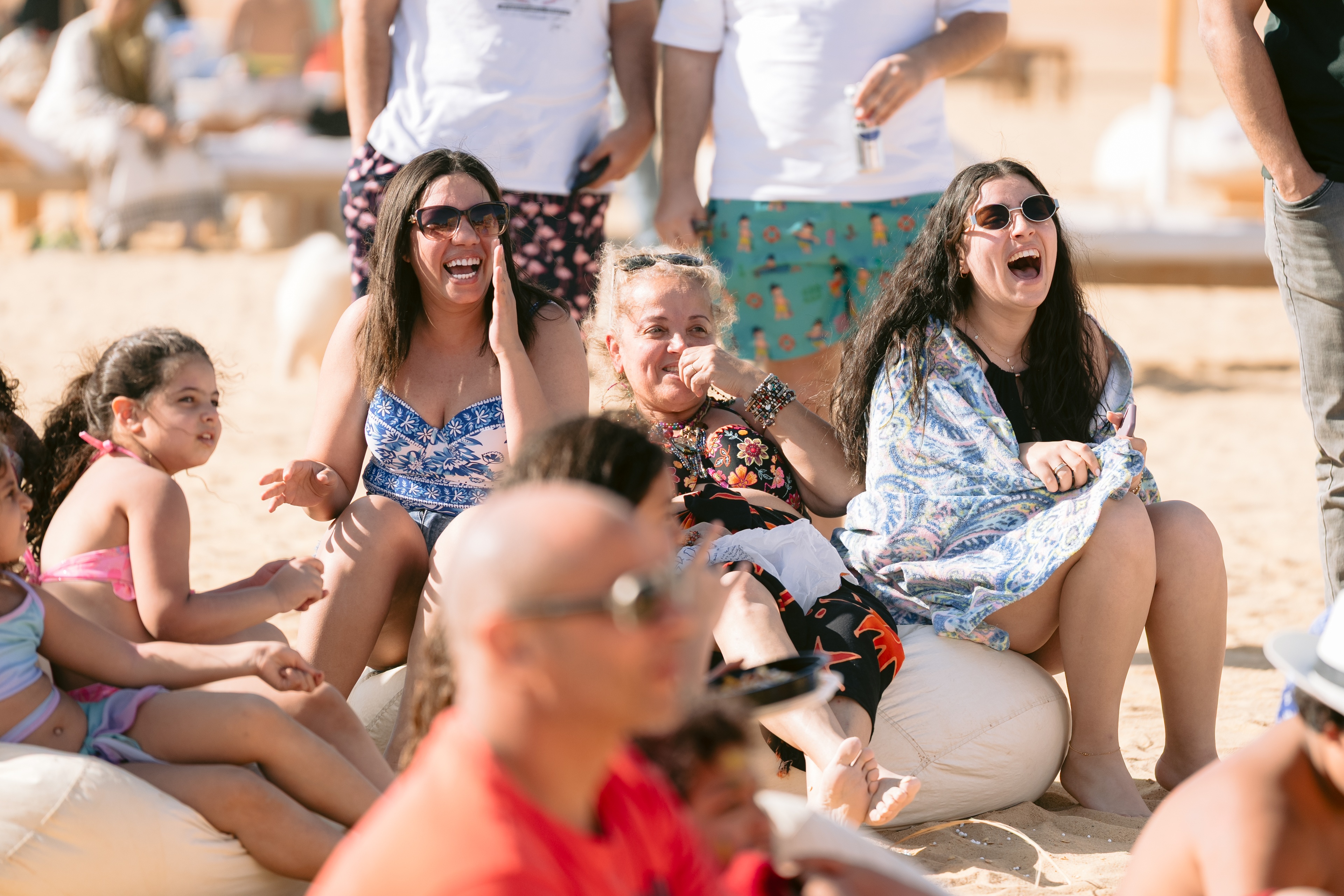 Guests sharing a relaxed, cheerful moment on BOHO Sokhna beach
